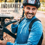 Smiling man with bicycle and backpack.