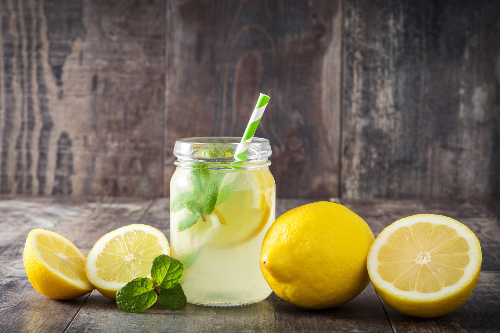 Homemade collagen electrolyte lemonade in a mason jar with fresh mint and lemon slices