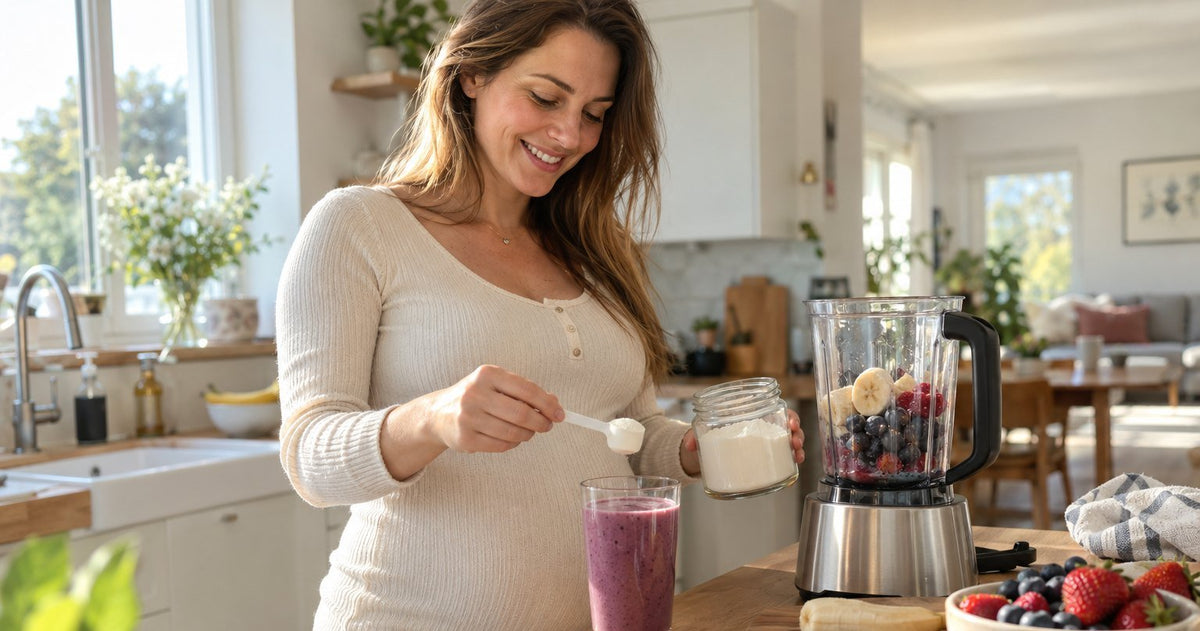 Pregnant woman adding a scoop of collagen peptides to a fruit smoothie in a home kitchen
